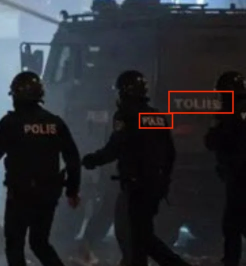Is the image showing police officers and a person in a Pikachu costume ...